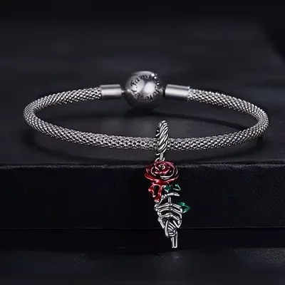 Halloween red rose on skeleton hand pendant charm — product image 1