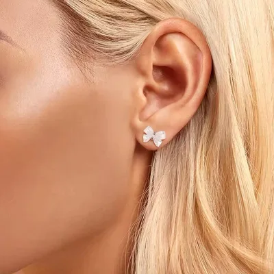 Resin bowtie sterling silver stud earrings — product image 1