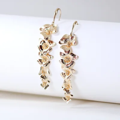 Gold plated orchid flower dangle drop earrings — product image 1