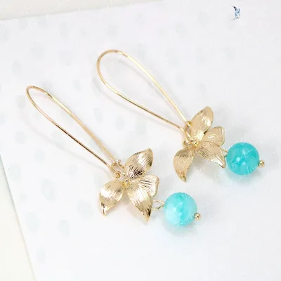 Gold plated orchid flower and stone drop earrings — product image 1