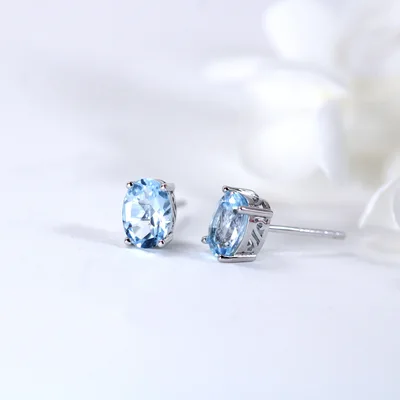 Oval Blue Topaz sterling silver stud earrings