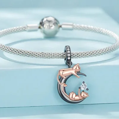 Playful cats on black moon dangle charm — product image 1