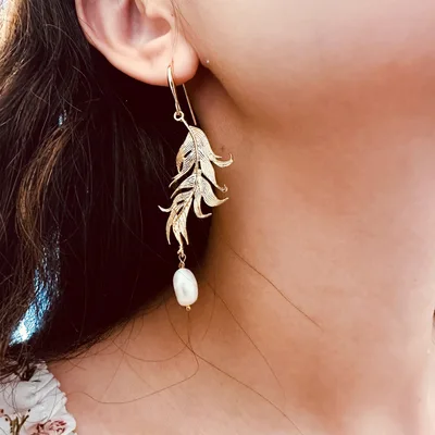 Gold plated feather freshwater pearl drop earrings — product image 1