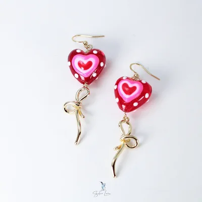 Sweet heart and bowtie gold plated drop earrings — product image 1