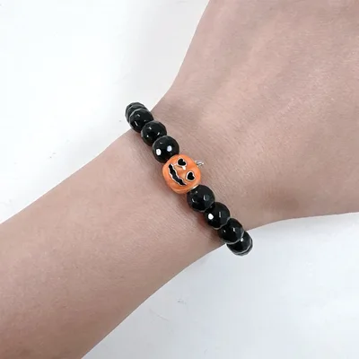 Glow in the dark Jack-O-Lantern black agate beaded bracelet — product image 1