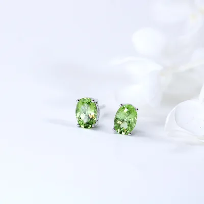 Natural green peridot egg shape stud earrings — product image 1