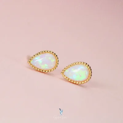 Teardrop opal sterling silver stud earrings — product image 1