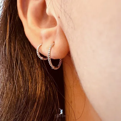 Minimalist twist hoop earrings in sterling silver — product image 1
